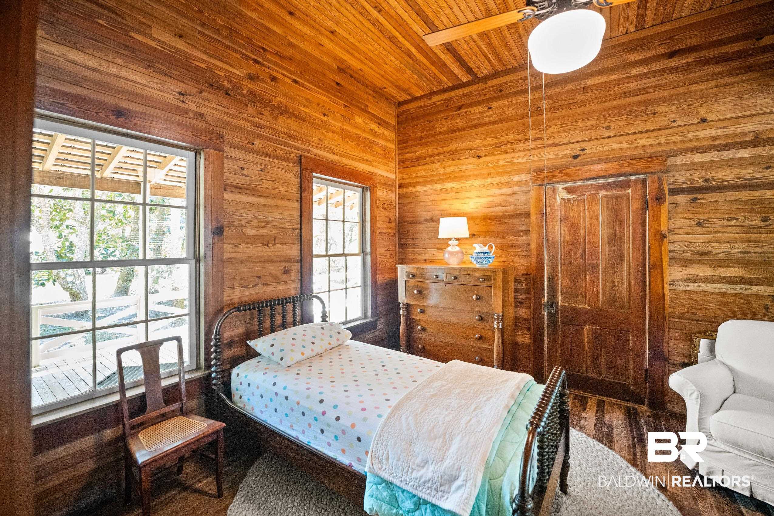 30671 Magnolia Street Elberta, AL 36530 - Photo 22 of 68 Bedroom with wood walls, wood ceiling, and wood finished floors