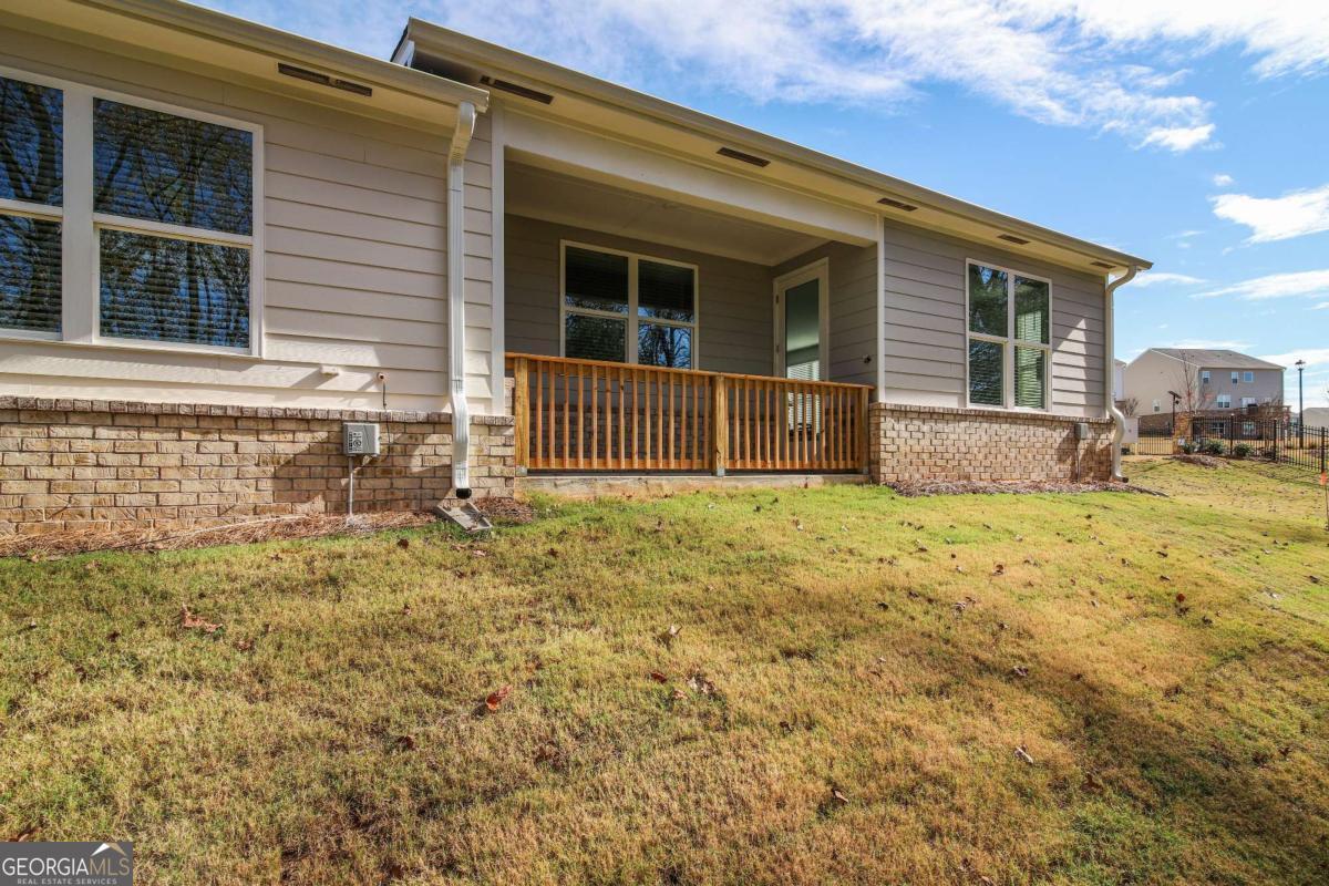 1517 Salinger Court, Unit 1517 Stockbridge, GA 30281 - Photo 18 of 26 a front view of a house with a garden