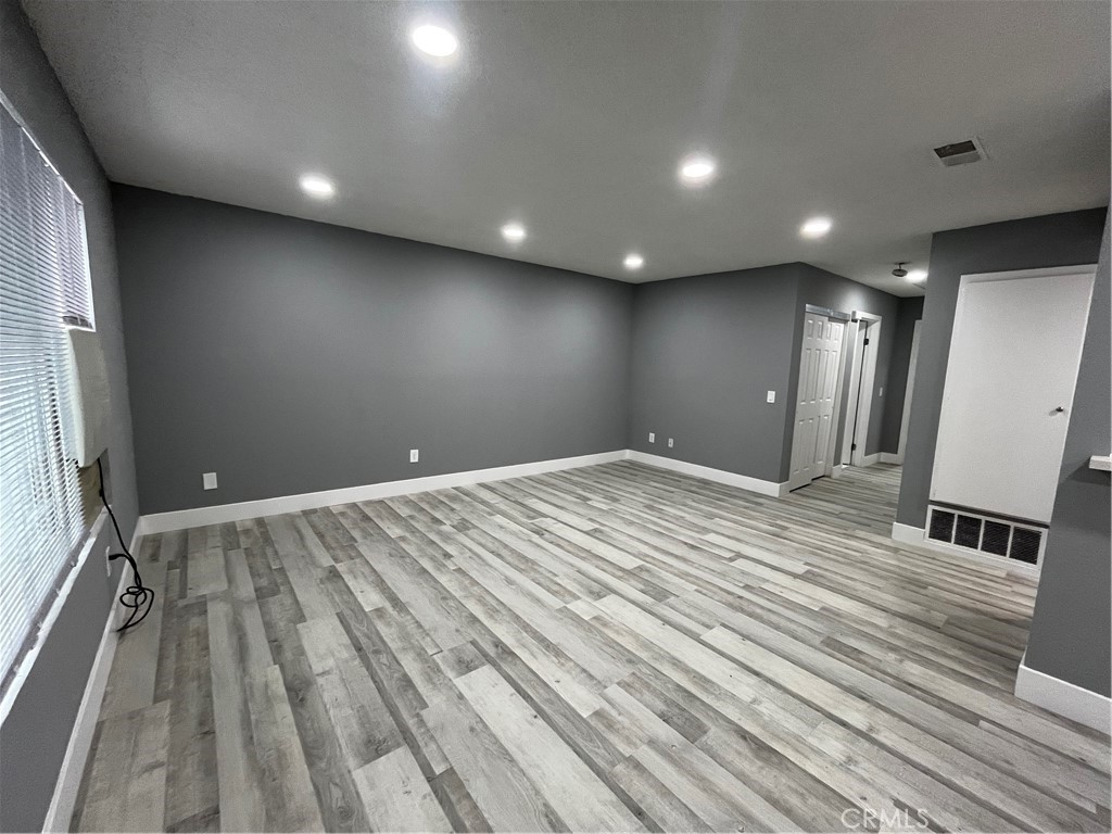 2405 Tahoe Circle, Unit B Hemet, CA 92545 - Photo 2 of 12 a view of room with wooden floor