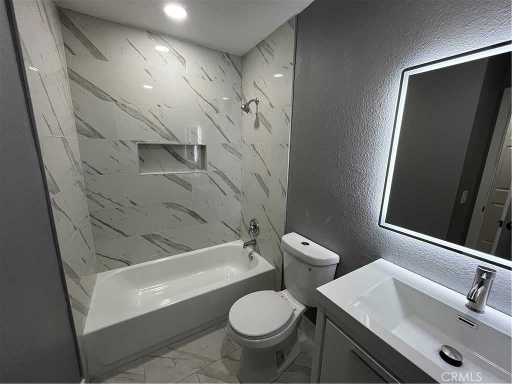 2405 Tahoe Circle, Unit B Hemet, CA 92545 - Photo 8 of 12 a bathroom with a sink toilet and shower