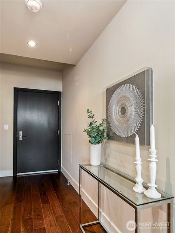 a view of an entryway with wooden floor