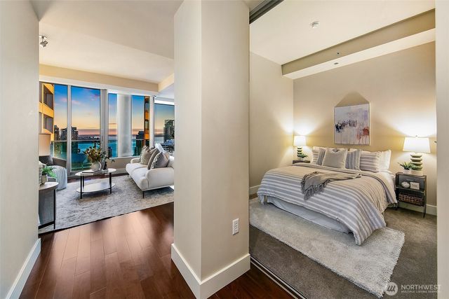 a bedroom with a large bed and a couch