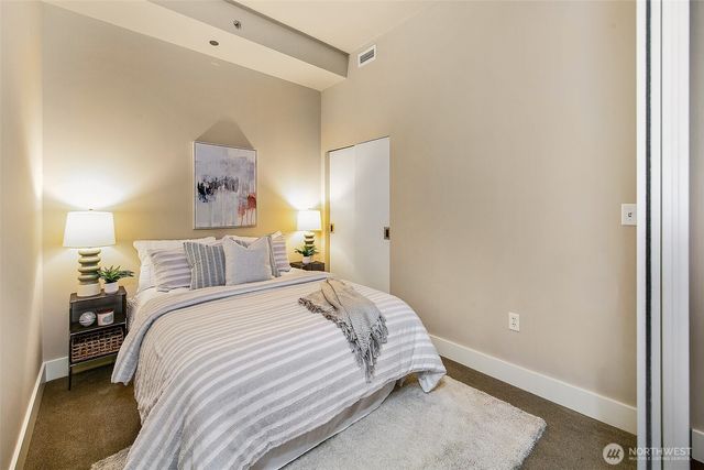 a bedroom with a bed and a closet