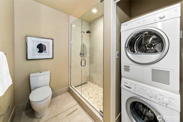 a bathroom with a toilet a sink and a shower