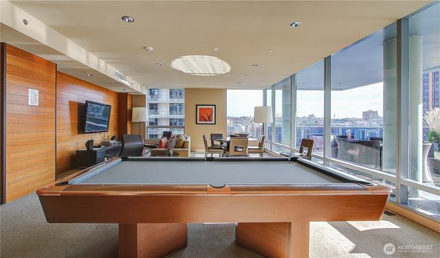 a view of a living room and a large window