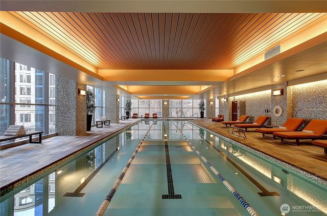 a view of swimming pool with a chairs