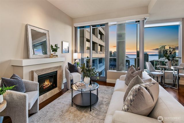 a living room with furniture and a fireplace