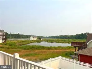 a view of a lake with a city from a balcony