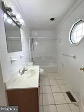 a bathroom with a sink a vanity and a mirror