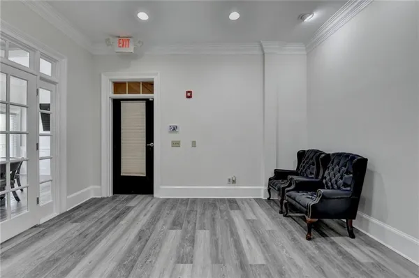 a view of a livingroom with furniture and a workspace