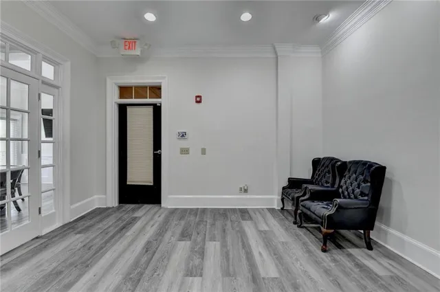 a view of a livingroom with furniture and a workspace