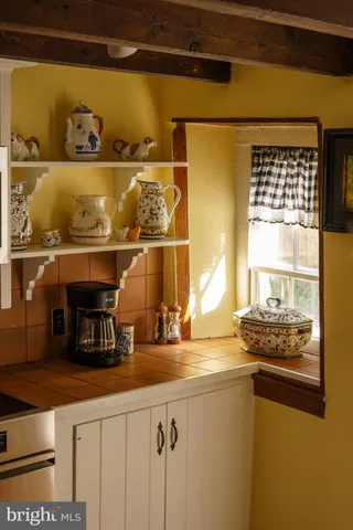 a kitchen with a sink and a stove