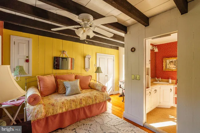 a bedroom with furniture and a chandelier