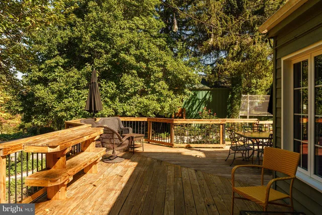 a view of a chairs and table on the deck