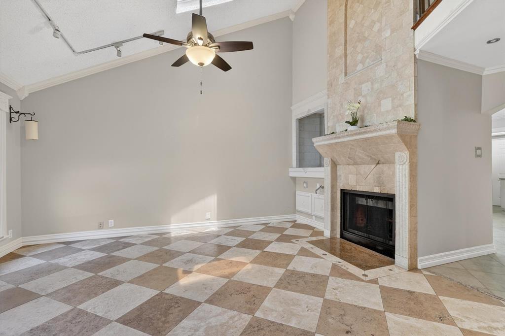 272 Lodge Road Coppell, TX 75019 - Photo 4 of 24 a view of a livingroom with a fireplace and a chandelier fan