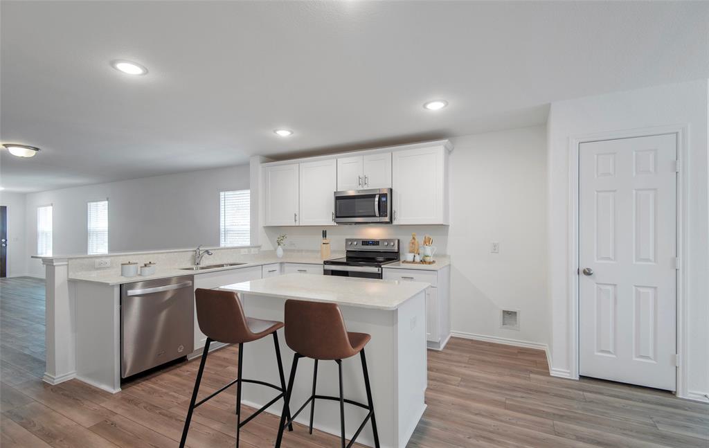 14134 Maida Drive Pilot Point, TX 76258 - Photo 6 of 14 *Model Representation - Spacious kitchen with eat-in bartop island