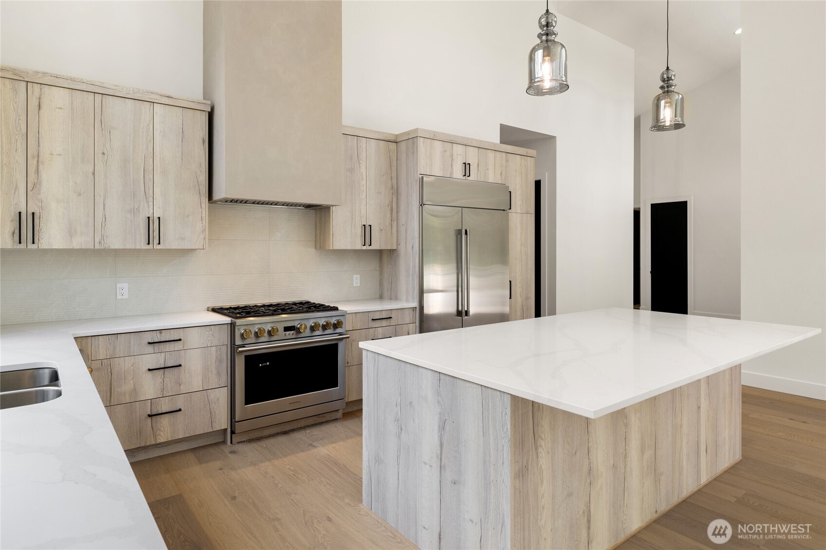 1920 Wanawish Loop Cle Elum, WA 98922 - Photo 10 of 17 a kitchen with stainless steel appliances a stove a refrigerator a sink and white cabinets