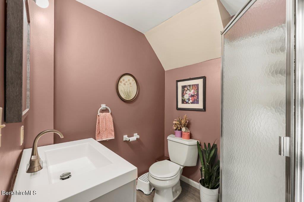 33 Eleanor Road Pittsfield, MA 01201 - Photo 20 of 45 a bathroom with a sink mirror vanity and toilet