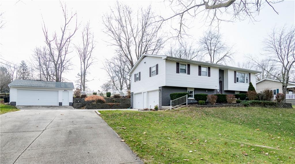 7 Green Oak Drive Decatur, IL 62526 - Photo 1 of 1 a view of a house with a yard covered with snow in front of house