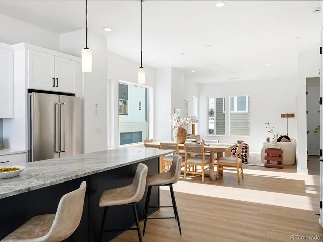 a very nice looking dining room with a table and chairs