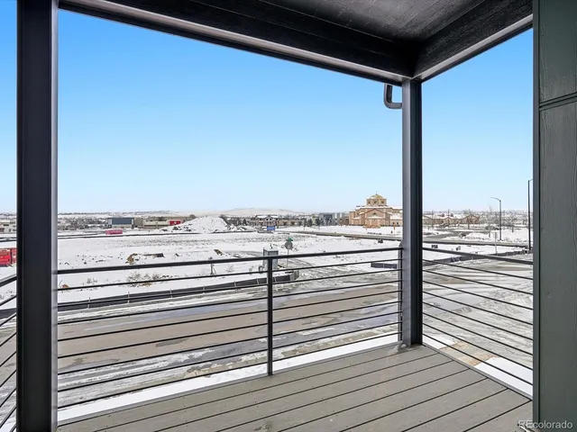 a view of a balcony with wooden floor