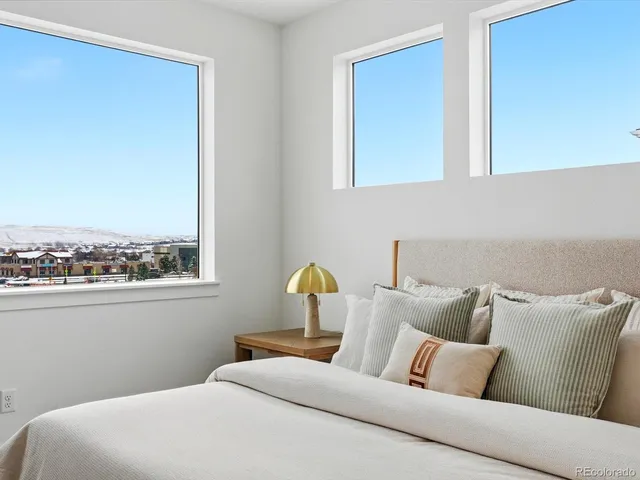 a bedroom with bed and window