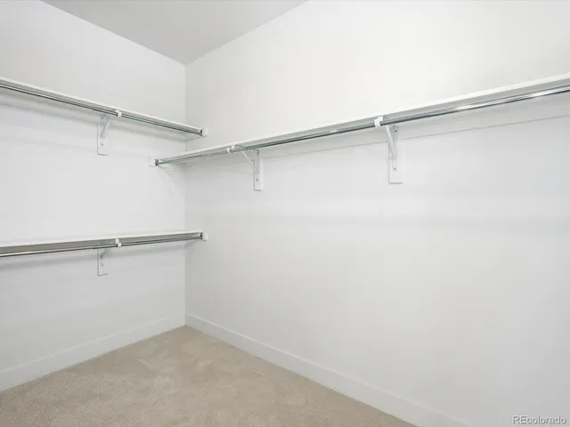 a view of an empty walk in closet