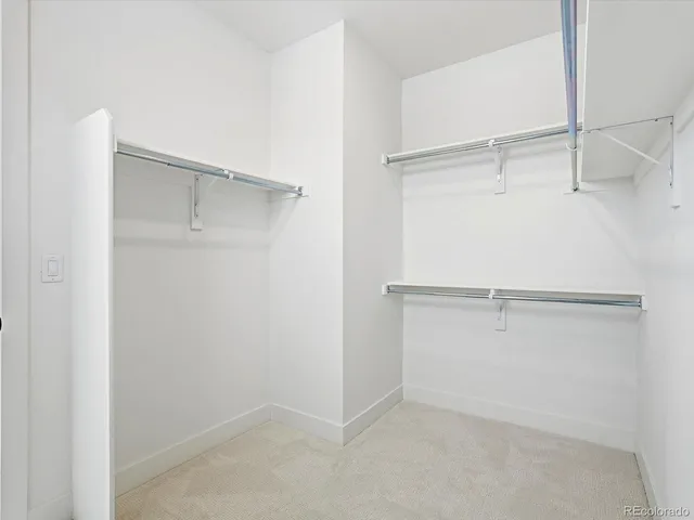 a view of an empty walk in closet