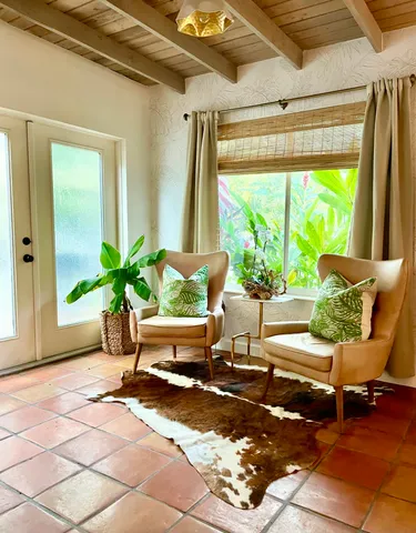 a outdoor living space with furniture and a potted plant
