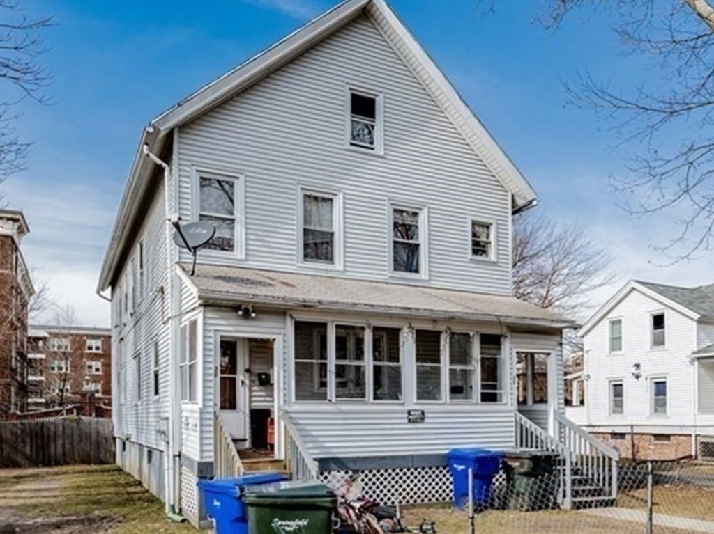 36-40 Marble Street Springfield, MA 01105 - Photo 5 of 5 a view of a house with wooden deck and furniture