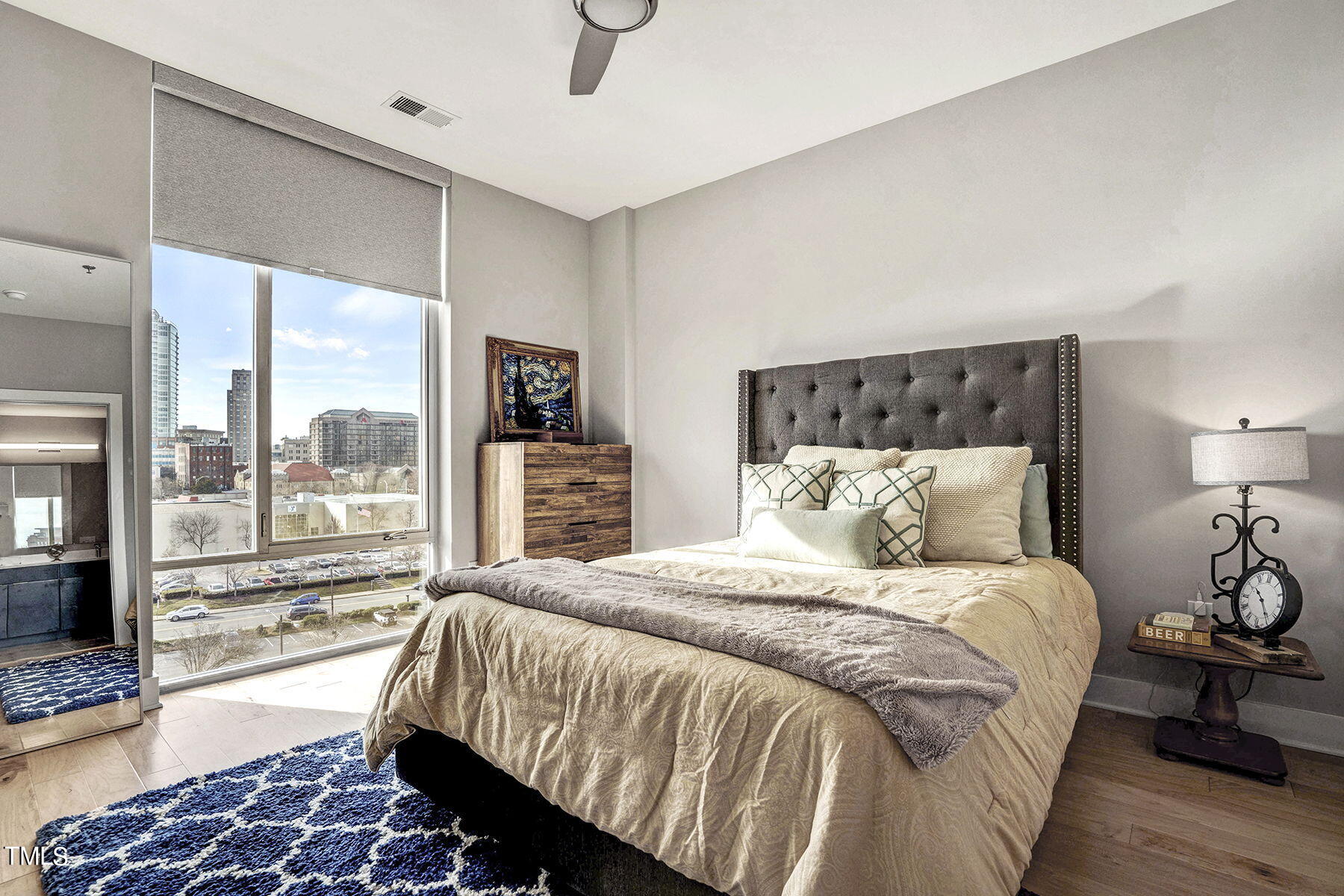 214 Hunt Street, Unit 711 Durham, NC 27701 - Photo 16 of 29 a bedroom with a large bed and a balcony view