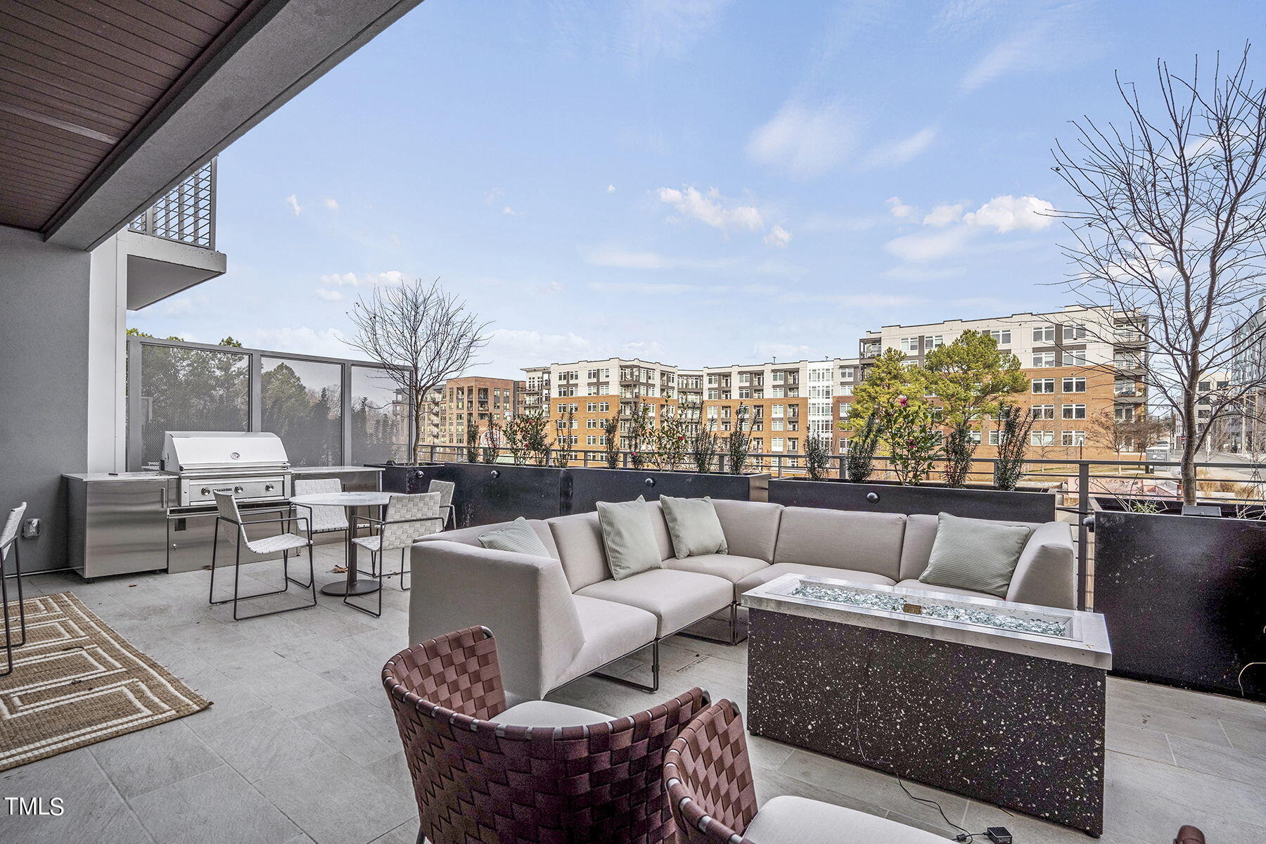 214 Hunt Street, Unit 711 Durham, NC 27701 - Photo 24 of 29 a roof deck with couches and potted plants