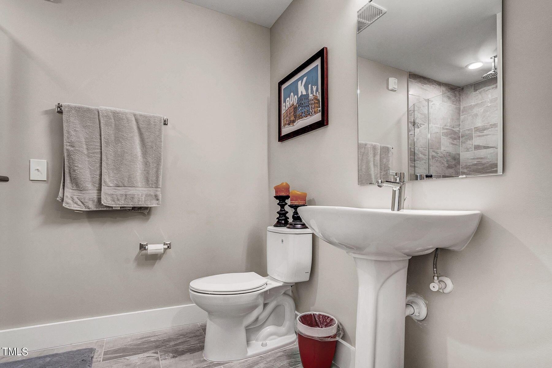 214 Hunt Street, Unit 711 Durham, NC 27701 - Photo 6 of 29 a bathroom with a sink toilet and mirror