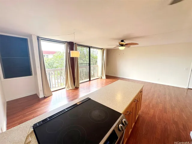 a view of a kitchen with wooden floor