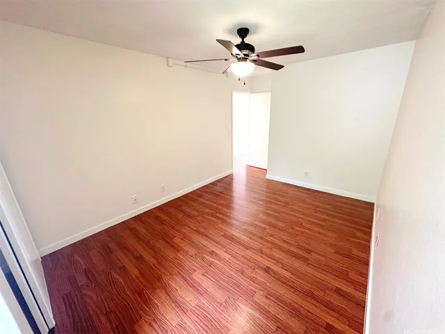 a bathroom with a toilet sink double vanity and mirror