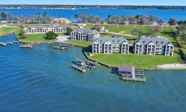 an aerial view of a house with outdoor space