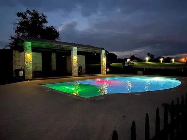 a view of a house with swimming pool and yard
