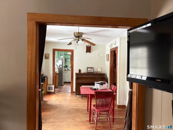 a view of a livingroom with furniture and a window