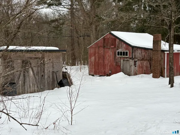 a view of wooden fence and a bench