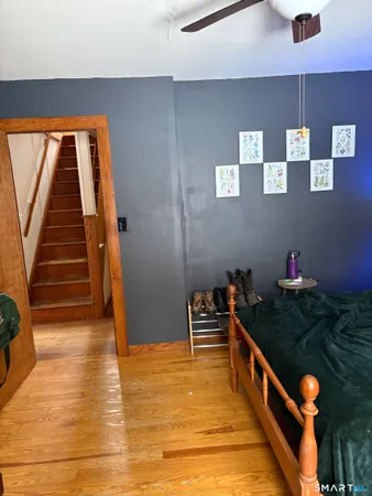 a view of entryway and hall with wooden floor