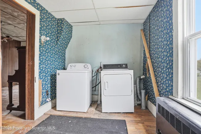 a utility room with dryer and washer