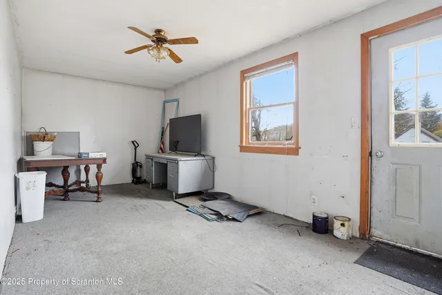 a view of a workspace with furniture