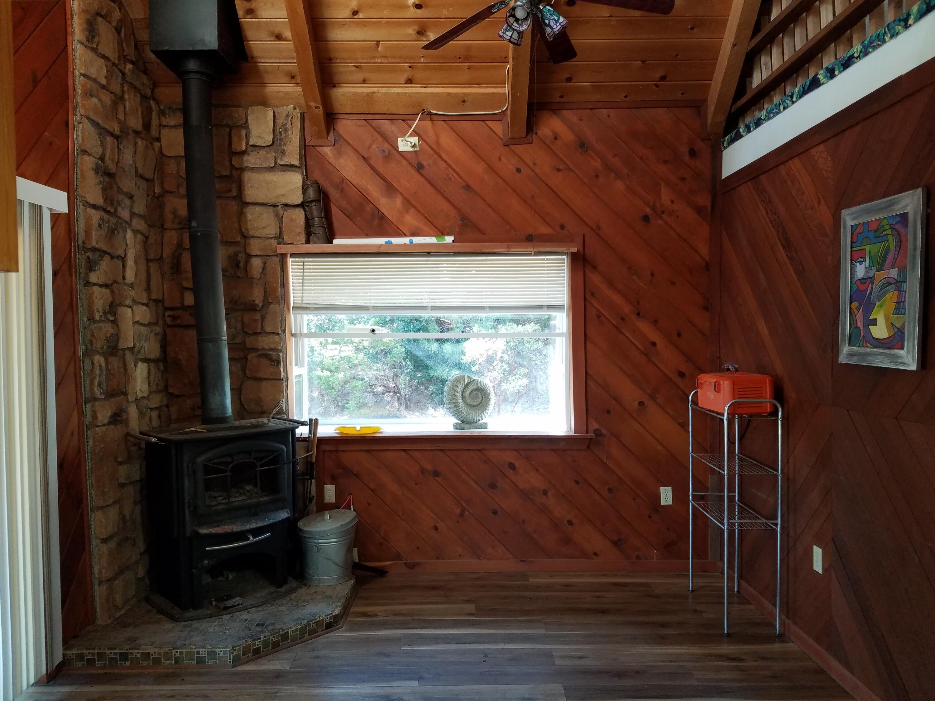 6200 Wilson Hill Road Shingletown, CA 96088 - Photo 29 of 53 a view of a fireplace in a room