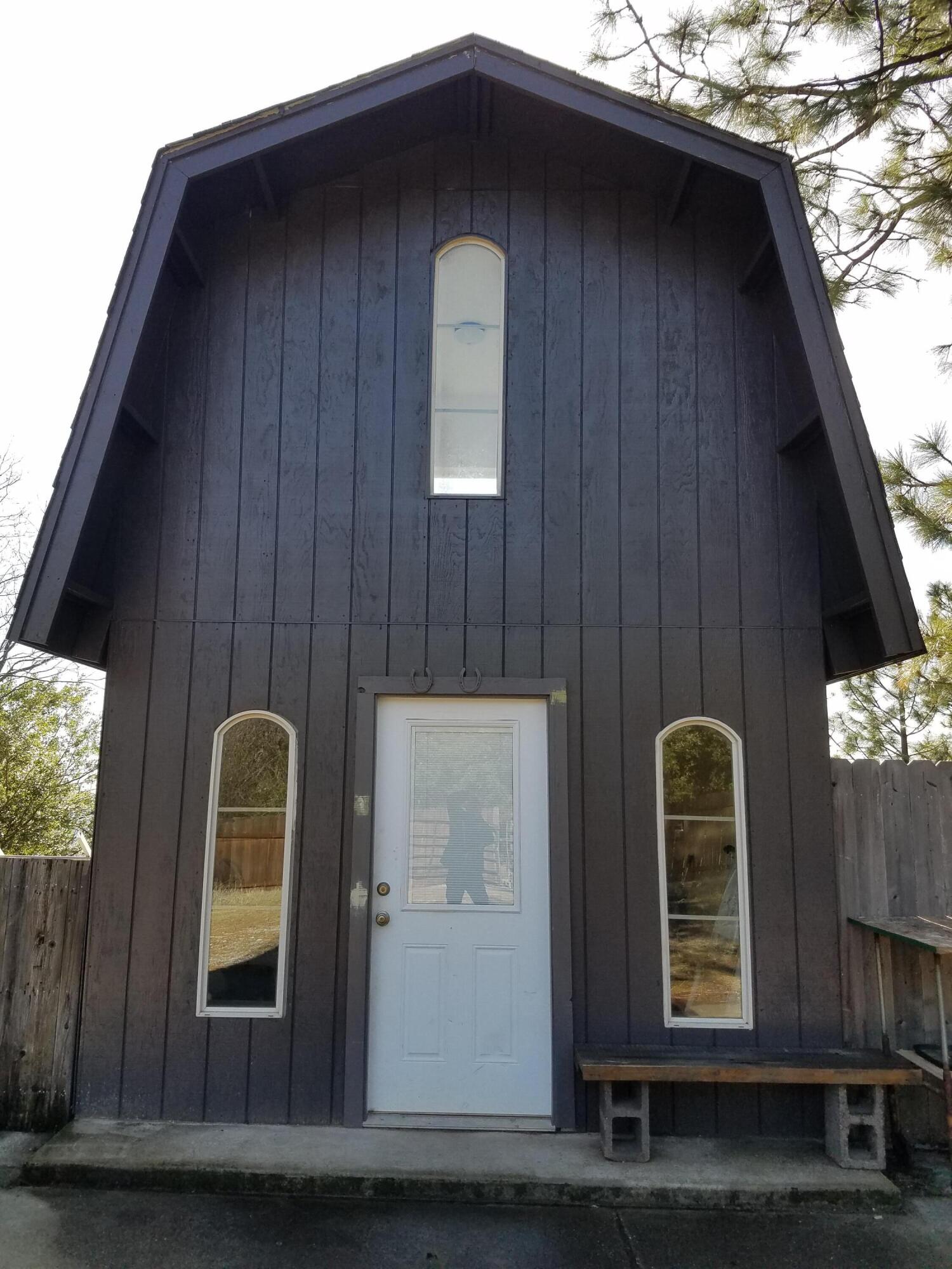 6200 Wilson Hill Road Shingletown, CA 96088 - Photo 40 of 53 a front view of a house with entryway