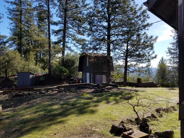 a view of backyard with green space