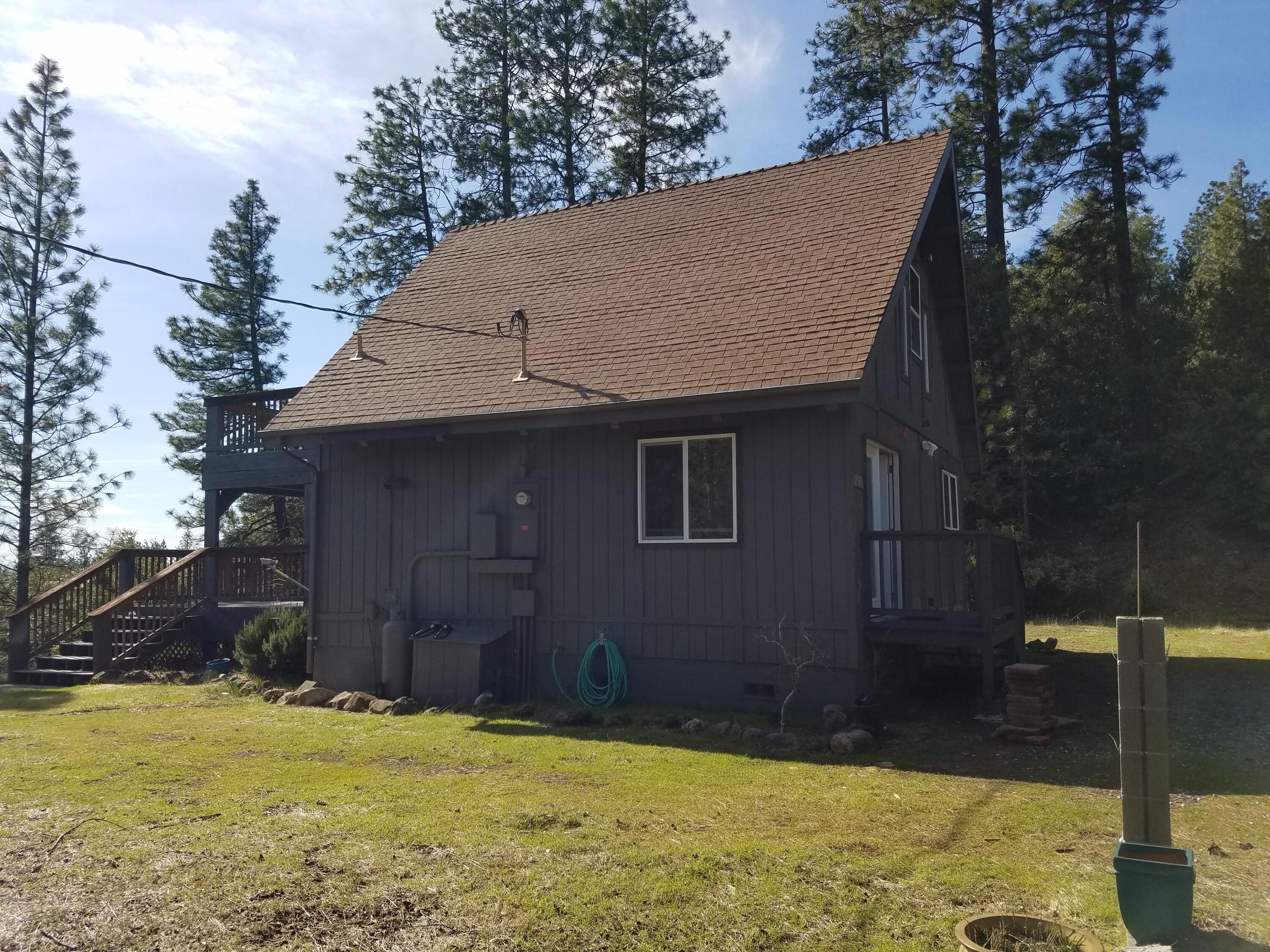 6200 Wilson Hill Road Shingletown, CA 96088 - Photo 6 of 53 a view of a house with a yard