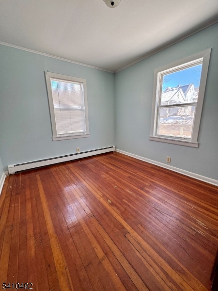 14 Glen Road Sparta, NJ 07871 - Photo 11 of 13 a view of an empty room with wooden floor and a window