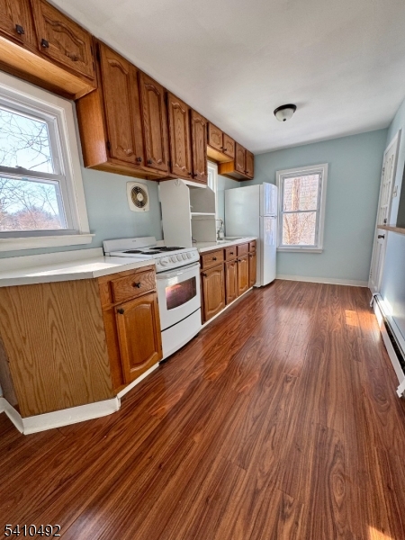 14 Glen Road Sparta, NJ 07871 - Photo 9 of 13 a kitchen with stainless steel appliances granite countertop a sink a stove wooden floor and cabinets