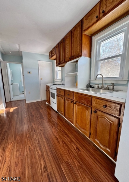 14 Glen Road Sparta, NJ 07871 - Photo 10 of 13 a kitchen with stainless steel appliances granite countertop a sink dishwasher stove and cabinets with wooden floor