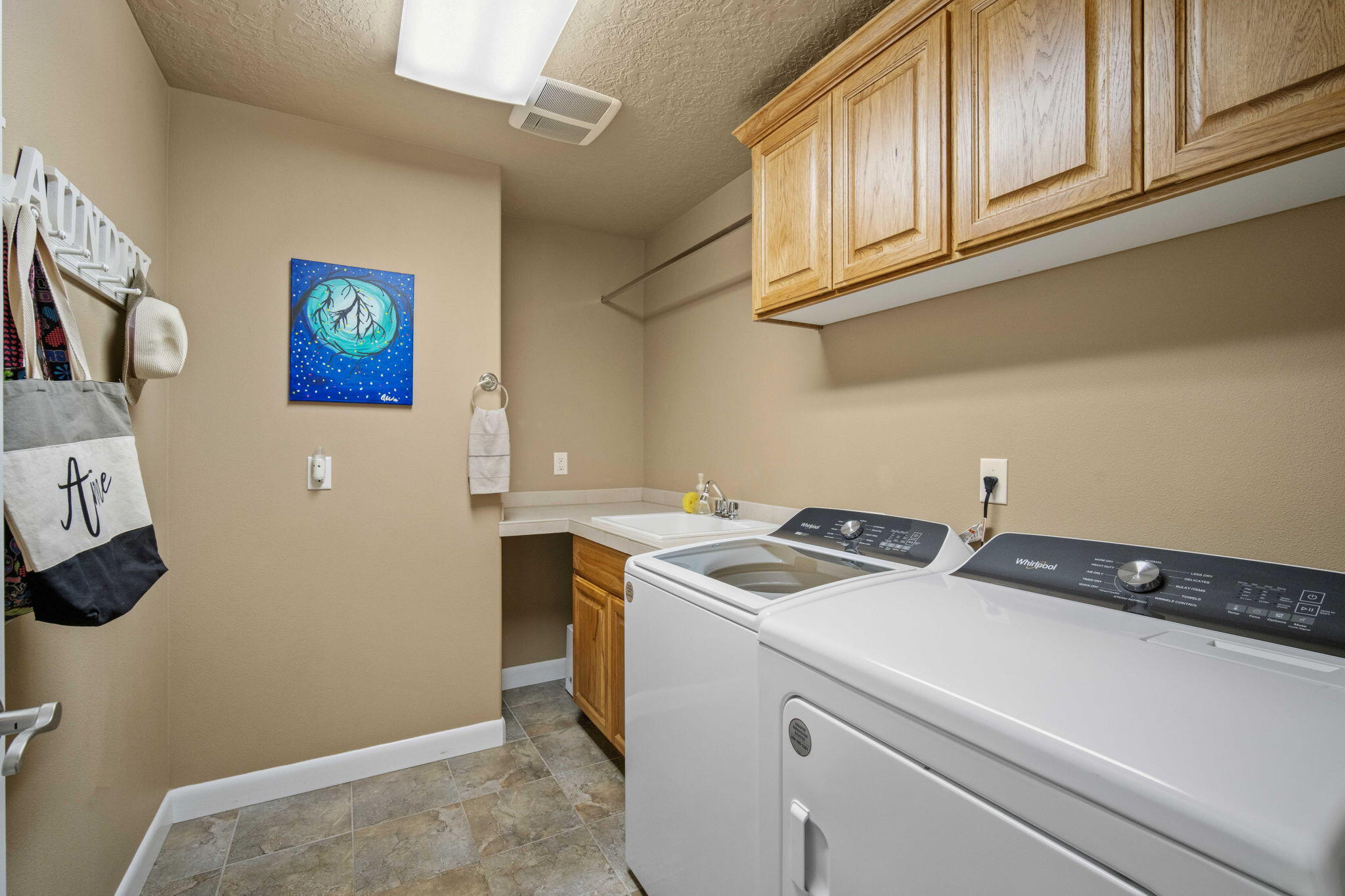 14234 Whitewater Loop La Pine, OR 97739 - Photo 42 of 62 Downstairs laundry room with utility sink